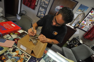 Marcos Garcia signs a Lucky 7 Customs used Devilbiss paint gun and  donates it to our Legends Toolbox for Veteran's effort!!