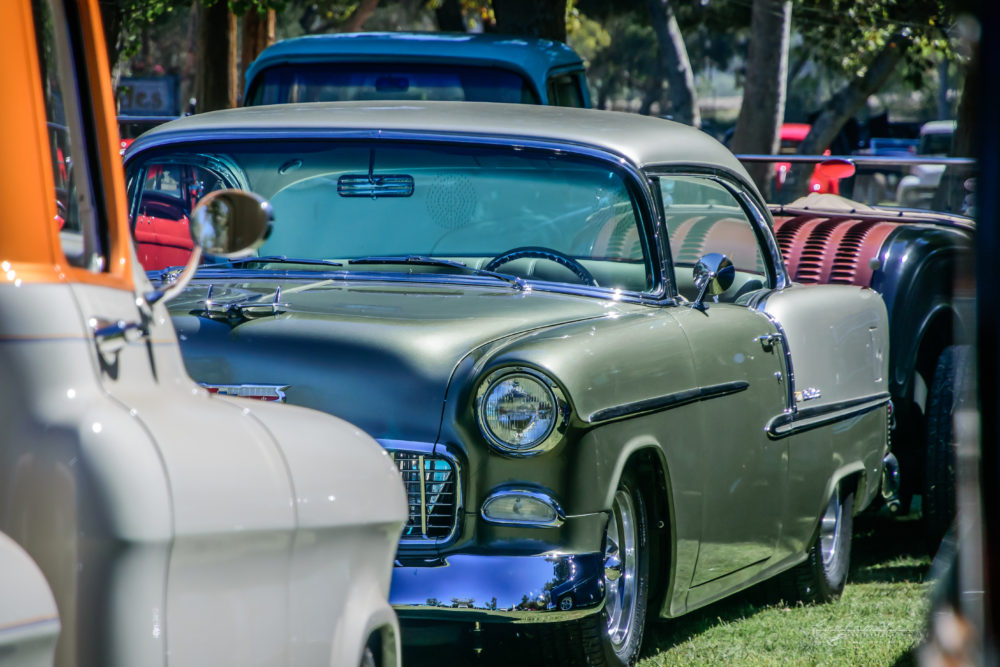 1955, Chevy, chevrolet, two toned, custom rod, outriders, left 3/4 front view, park, grass, lawn, trees, bumper, grille,