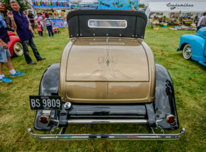 rear view, tail lights, shiny, bumper, pin striping, license plate, tank cover, 1932, 32, Roadster, ford, soft top, removable top, hot rod, big n' littles, chrome, paint, smooth, park, sky, clouds, car show, NSRA UK, K. Mikael Wallin, Customikes